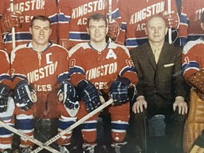 Charlie Convery, middle, between Garfield Ball, left, and manager Cliff Earl, in the team photo of the 1969-70 senior A Kingston Aces on display at the Kingston Memorial Centre.