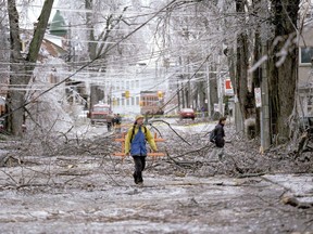 Pedestrians walk along Bagot Street during the first day of the 1998 ice storm in Kingston on Thursday, Jan. 8, 1998.