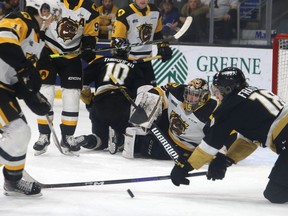 Kingston Frontenacs forward Gabriel Frasca tries to get to the puck in front of Hamilton Bulldogs goaltender Matteo Drobac in a scramble in Ontario Hockey League action at the Leon's Centre in Kingston on Saturday, Jan. 14, 2023.