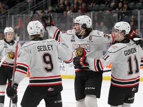 Owen Sound Attack captain Colby Barlow (middle) celebrates his goal against the Kingston Frontenacs with Sam Sedley, (left) and Cedrick Guindon during Ontario Hockey League action at the Leon's Centre in Kingston on Friday January 6, 2023. Ian MacAlpine/Postmedia Network/Kingston Whig-Standard