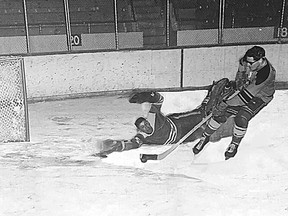 “Weiner” Dowdell, who played for Spada Tile at the time, dekes goaltender Paul Gratton for the final goal to clinch the Industrial League’s 7-4 victory over the Garrison League in a men’s all-star hockey game in 1970.
