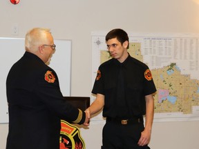 Chief Schroeder congratulated newly promoted firefighter Ben Lloyd at the promotion ceremony.