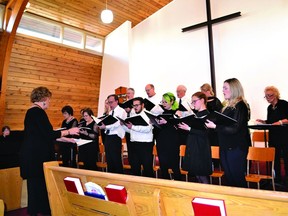 Foothills Regional Choir director Sue Moore leads the choir through their favourite songs during the performance on Jan. 22 at High River's Good Shepherd Lutheran Church.