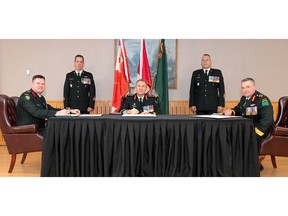 Taking part in the Signing of Scrolls to change over the command of 4th Canadian Division Support Group are, from left, incoming commander Col. Jason Guiney, 4CDSG formation sergeant-major Chief Warrant Officer Todd Buchanan, 4th Canadian Division commander Brig.-Gen Josh Major, 4th Canadian Division sergeant-major Chief Warrant Officer Jeramie Leamon, and outgoing 4CDSG commander , Brig.-Gen. John Vass. Garrison Petawawa imaging