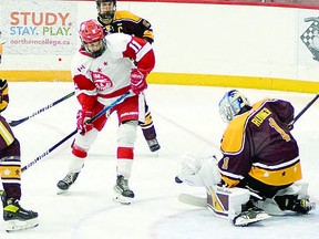 HOUNDS AND MAJORS Forward Carter Huckson of the Soo Jr. Greyhounds is thwarted by Timmins Majors goalie Sam Rudner in recent Great North Under 18 Hockey League action. Both teams are enjoying success this season. THOMAS PERRY/POSTMEDIA