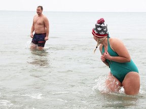 Matt Barnes and his wife Taryn organized a polar dip in Bright's Grove Sunday, raising money for addiction services at Bluewater Health. (Tyler Kula/ The Observer