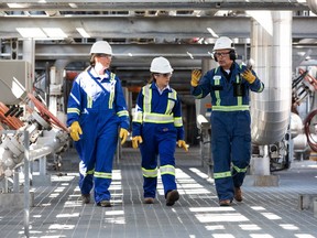 Deputy Prime Minister Chrystia Freeland, center, tours in August 2022 a hydrogen production facility in Alberta operated by Air Products.  FILE PHOTO/POSTMEDIA