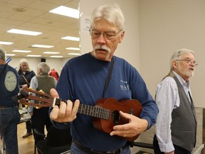 Al Olsen, a member of the Strangway Ukulele Ensemble, takes part in Saturday's open house at Sarnia's Strangway Center where the city's winter adult recreation programs were showcased.  Paul Morden/The Observer