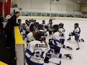 Members of the Lakeshore Lightning from the Windsor area receive direction during a timeout Saturday in a Girls' Silver Stick tournament game at the Clearwater Arena.  The tournament began Friday and runs through Sunday with teams from across Ontario and the US Paul Morden/The Observer
