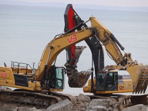 Heavy equipment is shown at work Wednesday on a shoreline protection project near Penhuron Avenue in Sarnia's Bright's Grove.  Work to repair shoreline protection on the St. Clair River near the Lambton Area Water Supply System north of the Blue Water Bridge is set to begin next week.  (PAUL MORDEN/The Observer)