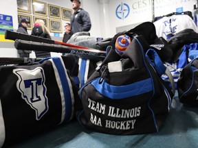 Hockey bags and sticks are shown on the floor Saturday outside the second rink at the Progressive Auto Sales Arena in Sarnia during the North American Silver Stick finals.