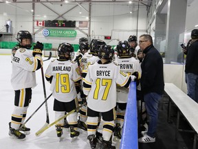 Coach Phil Talbot speaks with the U11 Lambton Jr. Sting during a break in a North American Silver Stick game Saturday at the Progressive Auto Sales Arena.