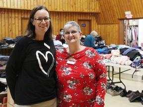 Residents displaced by the recent Fairwinds Lodge fire were able to pick from donated items at Community of Christ Church in Sarnia Saturday. Lisa Rufo with Sienna Senior Living Inc., left, and Pat MacGregor, church pastor, are pictured. (Tyler Kula/ The Observer)