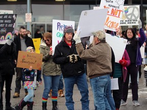 A protest clashes with a group of people rallying outside The Book Keeper Saturday morning ahead of a Drag Queen Story Time event being held there.  Terry Bridge/Sarnia Observer/Postmedia Network