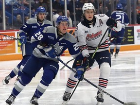Marc Boudreau, left, of the Sudbury Wolves, and Calum Ritchie, of the Oshawa Generals, battle for position during OHL action at the Sudbury Community Arena in Sudbury, Ont. on Friday January 6, 2023. John Lappa/Sudbury Star/Postmedia Network