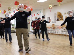 Norman Leroux, front left, Dianne Corbett, front right, and other members of the tai chi Fundamentals class, warm up during the first class of 2023 at the Canadian Tai Chi Academy - Timmins Branch, on Wednesday morning. Beginner classes start up Monday, Jan. 9th from 7 to 8:30 p.m., or Friday, Jan. 13 from 10:30 a.m. to noon. All classes are held at the Masonic Hall at 35 Tamarack St. The first class is free. 

NICOLE STOFFMAN/The Daily Press