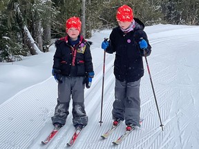 Wyatt Palik, 8,  gives his younger brother Dawson, 4, some cross-country skiing tips at the Porcupine Ski Runners Club, Thursday afternoon. Timmins has received less-than-normal snowfall so far this winter but that hasn't stopped downhill and cross-country skiing facilities from operating.

NICOLE STOFFMAN/The Daily Press