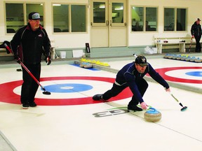 Lyle Broderson from Claresholm throws a rock Jan. 8 during the G3 Open Farmers Spiel, at the Carmangay Curling Rink. The event was the first time curlers had played the sport at the rink since the start of the COVID-19 pandemic in March 2019. Broderson, who plays third, along with second Derrick Annable, left, skip Paul Morrison and lead Dan Greene, were the first-event winners at the bonspiel.