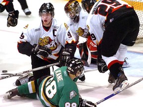 Former Owen Sound Attack captain Bobby Ryan (pictured here flattening former London Knight Pat Kane in front of Attack goalie Anthony Guadagnolo and Phil Oreskovic in the first period of Game 2 of the OHL Western Conference quarter-final last night in Owen Sound in 2007) returns to the Bayshore Friday night for the Celebrity and Alumni game on the eve of Hockey Day in Canada. Morris Lamont/Postmedia file photo