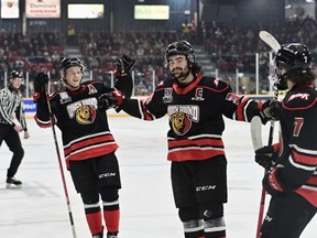 Colby Barlow celebrates a first-period goal with Sam Sedley and Deni Goure as the Owen Sound Attack host the Peterborough Petes inside the Harry Lumley Bayshore Community Centre for Hockey Day in Canada on Jan. 21, 2023. Sam Buschbeck/Owen Sound Attack