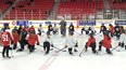 Greg Schell, the Toronto Maple Leafs coordinator of hockey development, begins the Maple Leafs Hockey Clinic at the Harry Lumley Bayshore Community Centre Thursday afternoon surrounded by members of the Owen Sound Ice Hawks girls' hockey program. Greg Cowan/The Sun Times