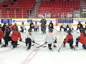 Greg Schell, the Toronto Maple Leafs coordinator of hockey development, begins the Maple Leafs Hockey Clinic at the Harry Lumley Bayshore Community Centre Thursday afternoon surrounded by members of the Owen Sound Ice Hawks girls' hockey program. Greg Cowan/The Sun Times