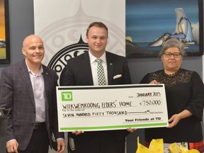 A cheque for $750,000 presented by John Doris, VP of TD Commercial Banking in Sudbury, and  Tanner Bell, TD Little Current branch manager, to Ogimaa Kwe Rachel Manitowabi (supplied).