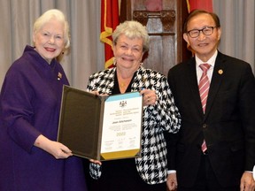 Stratford volunteer Jean Aitcheson receives an Ontario Senior Achievement Award from Lt-Gov. Elizabeth Dowdswell and the province’s minister for seniors and accessibility, Raymond Cho. (Contributed)