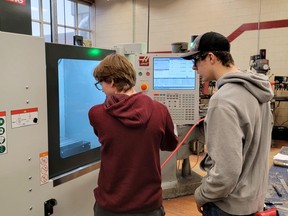 Students at Stratford District Secondary School learn to use a Haas CNC Mini Mill that was recently delivered to their school. The piece of equipment, which is used in small-parts machining, is among roughly $280,000 in state-of-the-art manufacturing equipment donated to Stratford District Secondary School, St. Marys District and Vocational Institute, Central Huron Secondary School and Stratford Intermediate School through the Canadian Tooling and Machining Association's Expanding Opportunities program in partnership with the Ontario Council for Technology Education. (Submitted photo)