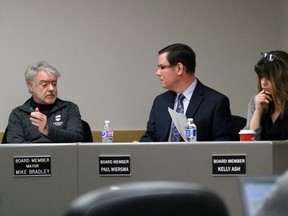 From left, Sarnia Mayor and police board member Mike Bradley, new board chairperson Paul Wiersma and new board vice-chairperson Kelly Ash have a discussion during Thursdays meeting at Sarnia police headquarters. (Terry Bridge/Sarnia Observer)