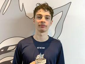 Sudbury Wolves goaltender Nate Krawchuk poses with the game puck from his first OHL shutout in Sudbury, Ontario on Friday, February 3, 2023.