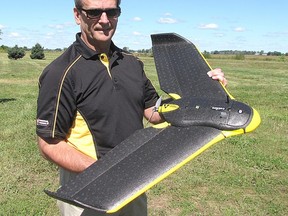 Dale Cowan, agronomy strategy manager and senior agronomist at the Chatham-based AGRIS Co-operative, is shown in 2014 with a drone during a county tour stop in Ridgetown. (File photo/Postmedia Network)