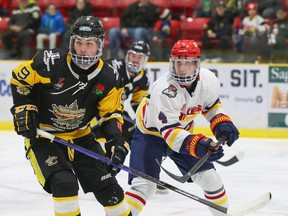 Robbie Rutledge #9 of the Trenton Golden Hawks and Nolan Mozer #4 of the Wellington Dukes follows the play during the first period at Lehigh Arena Friday night. The Dukes clinched the Hasty P’s Cup with a 6-3 win. ED MCPHERSON