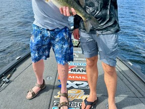 Bill Godin and Jeff Gustafson with a big bass that Bill caught last week in Florida.