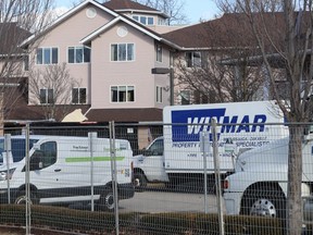 Property restoration vehicles are parked Wednesday outside of Fairwinds Lodge retirement home in Sarnia.  (Paul Morden/Sarnia Observer)