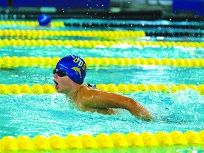 Logan Van Huis swims during a 2022 meet for the Dolphins. (Devon Dolphins Swim Club)