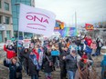 A rally to protest the privatization of public health care was held with a gathering of about 50 people Saturday outside 1730 St. Laurent Blvd., a building that houses the Herzig Eye Institute Saturday,