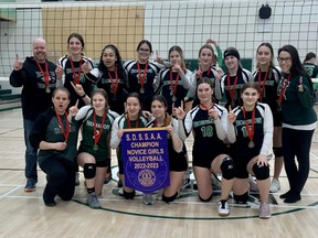 Players and staff from the Horizon Aigles gather for a photo to celebrate their SDSSAA novice volleyball championship.