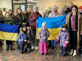 Members of Ukrainian community gather in the lobby of the Civic Centre before a formal Ukrainian flag raising on the steps of city hall by Mayor Matthew Shoemaker.   ELAINE DELLA-MATTIA
