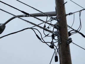 The ice storm that occurred Wednesday and overnight into Thursday caused power outages throughout Chatham-Kent. Shown is a pole on Winter Line Road in Pain Court. (Trevor Terfloth/The Daily News)