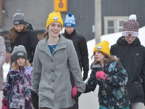 Sisters Kennedy Prescott, 14, and Isla Prescott, 8, take part in the Coldest Night of the Year walk in Owen Sound, held to support those experiencing hunger, homelessness and mental health concerns, on Saturday, February 25, 2023.