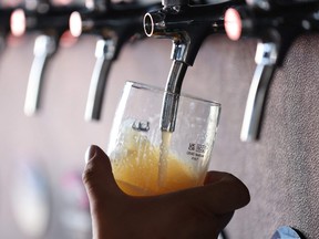 Pouring a draft beer.