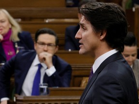 Prime Minister Justin Trudeau speaks during Question Period in the House of Commons on Parliament Hill in Ottawa February 1, 2023 as Pierre Poilievre listens.