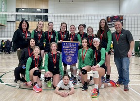 Players and staff from the Horizon Aigles gather for a photo to celebrate their SDSSAA Senior Girls Division I Volleyball Championship.