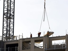 A new 14-storey Tricar tower grows at 309 Southdale Rd. in Westmount Estates in London on Wednesday, Feb.  8, 2023. The London region added 1,700 jobs in January lowering the unemployment rate to five per cent.  (Mike Hensen/The London Free Press)