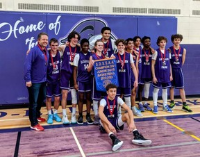 The Lo-Ellen Knights junior basketball players and coaches celebrate winning the SDSSAA Division I title.
