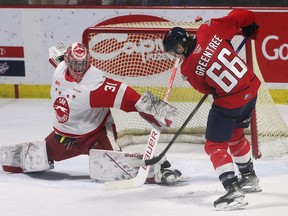 Soo Greyhounds goalie Charlie Schenkel makes a toe save on Liam Greentree on Thursday at the WFCU Centre in Windsor. Schenkel stopped 28 shots as the Hounds lost 5-4 in OT to the Spitfires.