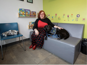 Zebra Child and Youth Advocacy Centre chief executive officer Emmy Stuebing with Captain, the facility dog, on Tuesday, Feb. 14, 2023. GREG SOUTHAM/Postmedia