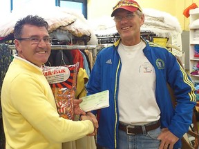 Tony McGarvey, Director of Finance at Hawkin's Cheezies, presents Boyd Kalnay a donation cheque. The company has been a great community sponsor and promoter for nearly 75 years, and the Cheezie remains iconic from coast to coast. SUBMITTED PHOTO