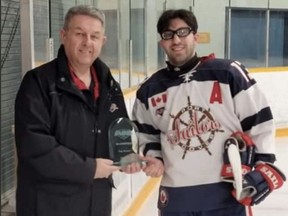 Port Dover Sailors player Nick D'Agostino (right) was recently awarded the Provinicial Junior C Hockey League's Bloomfield Division player of the month award for December by Steve Sumka of the PJHL.